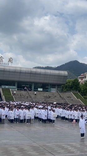 White-coated group gathers outside Chongqing canteen building