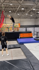 Young man practices jumps, backflips at Krasnoyarsk trampoline park