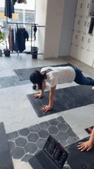 Two women exercise at modern Puebla gym studio