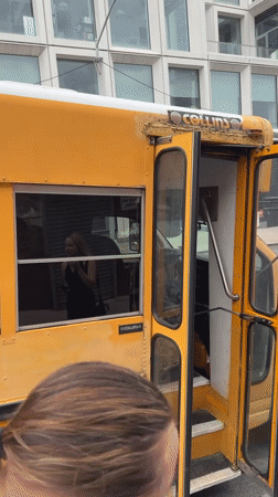 DJ set happening inside a parked NYC school bus