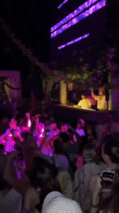 Nighttime party crowds gather at Bali cliff venues