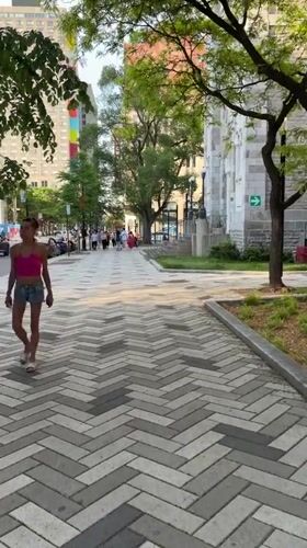 Street musicians perform in Montreal plaza during evening hours