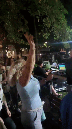 Live outdoor concert in Podgorica, crowd dancing under stage lights