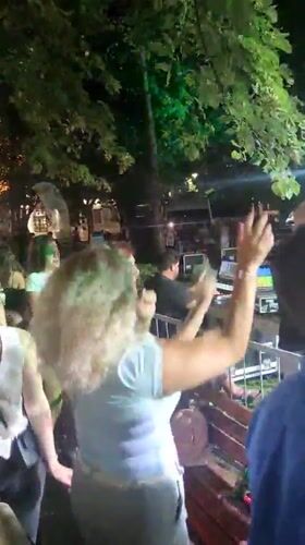 Live outdoor concert in Podgorica, crowd dancing under stage lights