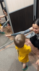 Woman drinks Jägermeister with child and friend in Noviy