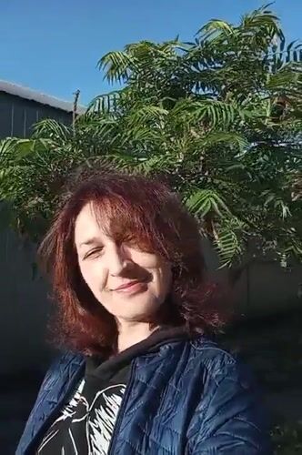 Woman photographed smiling outdoors in Rivne, Ukraine