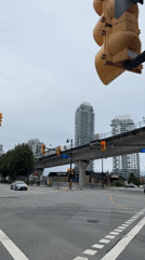 SkyTrain passes over Lougheed Town Centre on a cloudy evening