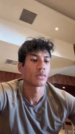 Young man records himself eating burrito meal in LA restaurant