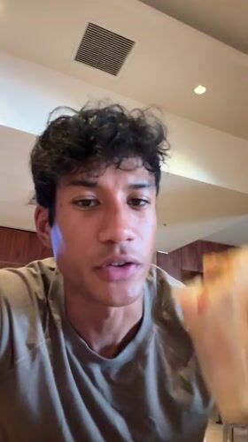 Young man records himself eating burrito meal in LA restaurant