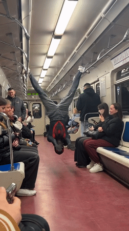 Spider-Man costumed performer does subway acrobatics in Russian train