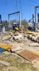 Excavator performs earthwork at Bulgarian electrical substation