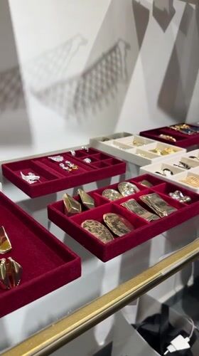 Browsing jewelry and sneakers in a Yerevan retail store