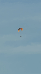 Paraglider and boat spotted in calm conditions near Wichit coastline