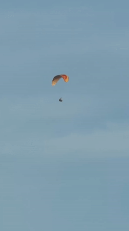 Paraglider and boat spotted in calm conditions near Wichit coastline
