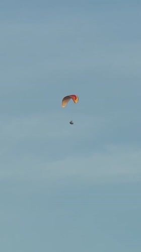 Paraglider and boat spotted in calm conditions near Wichit coastline