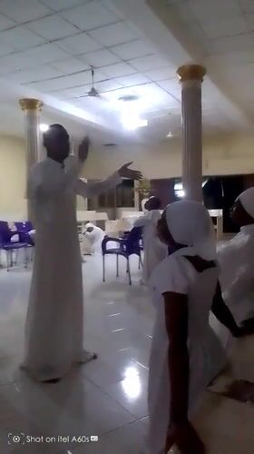 White-robed religious gathering documented in Lagos neighborhood