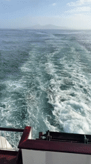 Ferry passengers enjoy sunny morning journey near Corralejo, Spain