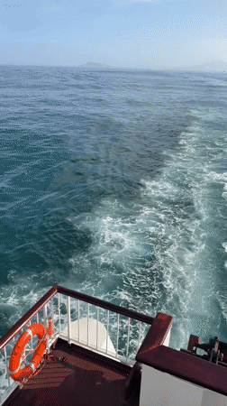 Ferry passengers enjoy sunny morning journey near Corralejo, Spain
