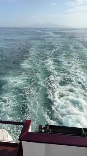 Ferry passengers enjoy sunny morning journey near Corralejo, Spain