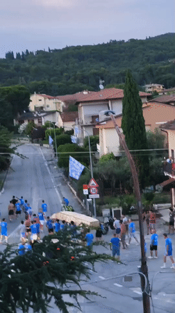 Traditional procession through Passignano sul Trasimeno at dusk