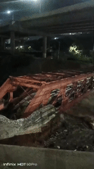 Nighttime scenes across Caracas show collapsed bridge, pedestrian activity
