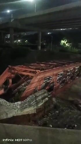 Nighttime scenes across Caracas show collapsed bridge, pedestrian activity