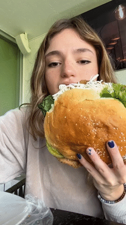 Woman enjoys oversized sandwich dinner in Mexican town
