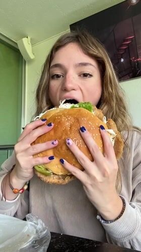 Woman enjoys oversized sandwich dinner in Mexican town