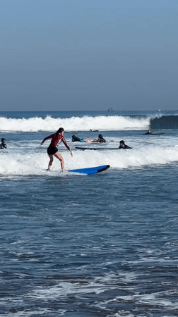 Late night surfing activity documented in Kuta, Indonesia