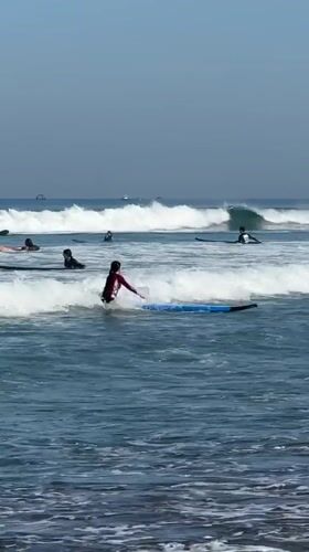 Late night surfing activity documented in Kuta, Indonesia