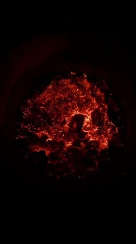 Late-night fire burns in metal pit in Arica, Chile