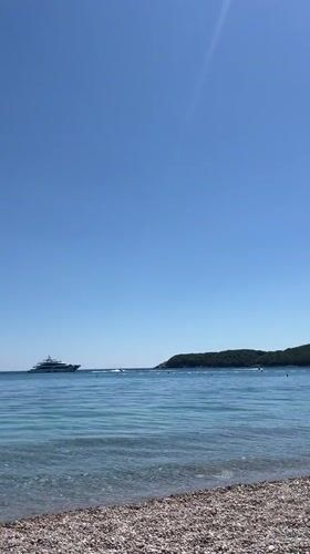 Beach day documented in Prijevor, Montenegro with cider and coastline