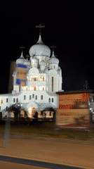 Illuminated Orthodox church filmed at night in Saint Petersburg