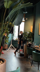 Live music performance featuring dreadlocked vocalist at restaurant