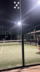 Nighttime padel match captured in Benitachell, Spain