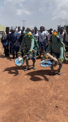 Traditional dancers perform cultural street show in Durimi, Nigeria