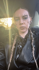 Punk-styled individual documented in vehicle in Krasnoyarsk