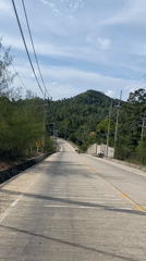 Morning road travel documented in rural Thailand