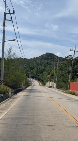 Morning road travel documented in rural Thailand