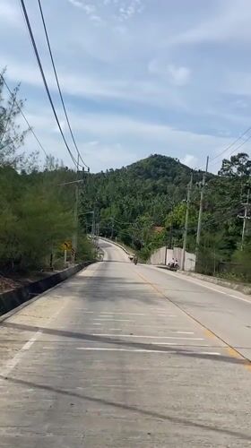 Morning road travel documented in rural Thailand