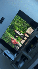 Large TV displays video content in Cape Town entertainment area