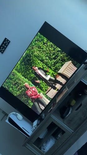 Large TV displays video content in Cape Town entertainment area