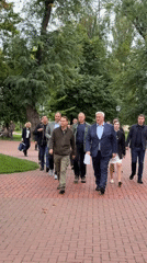 Afternoon stroll along a brick park path in Kyiv