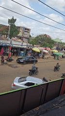 Man uses smartphone on balcony in Markurdi, Nigeria