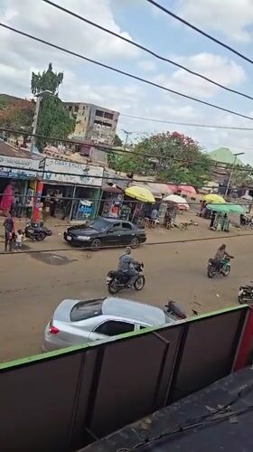 Man uses smartphone on balcony in Markurdi, Nigeria