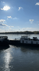 Boats navigate Danube River at Ruse under sunny skies