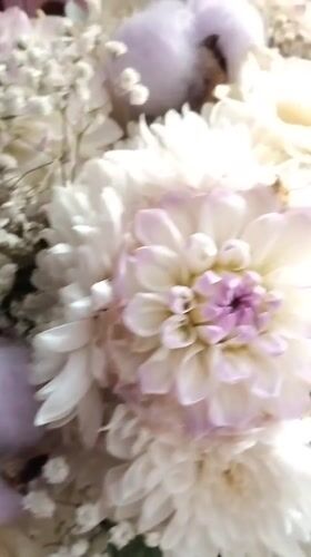 Flower arrangements and a toddler swinging in Bila Krynytsia
