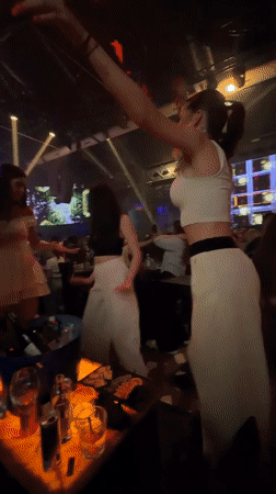 Late night club celebration with dancing and streamers in Burgas