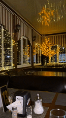 Cozy, fairy-lit cafe interior in Zhlobin, Belarus