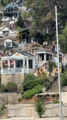 Hillside cemetery with varied mausoleums documented in Da Lat